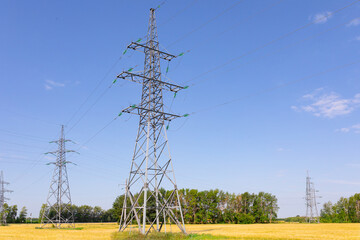 High Tension Line on a summer field. Summer photo