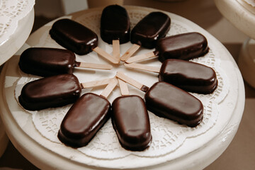 chocolates on a stick on a plate