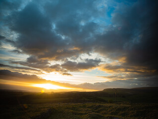 A vibrant golden sunset over the Yorkshire Dales
