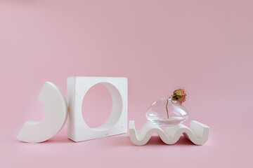 Abstract white podium with colored figures on a fashionable background for advertising, front view