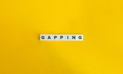 Gapping Word on Letter Tiles on Yellow Background. Minimal Aesthetics.