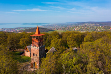 Alsóörs, Hungary - Aerial view about lookout tower on Csere mountain, with lake Balaton at the...
