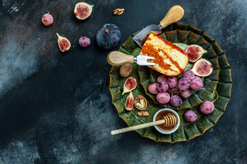 Cheese platter. Assorted cheese, wine ham, fruit, bread sticks, nuts. banner, menu, recipe place for text, top view