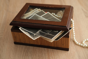 stack of yellow, orange clothes, books, autumn leaves, cup of hot tea, coffee, seasonal concept, cozy autumn mood