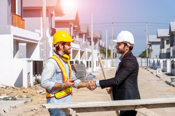 Engineer man handshake with businessman after finishing up meeting in construction site,Hand shake concept.