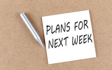PLANS FOR NEXT WEEK text on sticky note on cork board with pencil ,