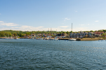 Fototapeta na wymiar Boats in the harbour in Kivik, Sweden. Popular tourist destination.