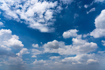 Blue sky background with white clouds floating