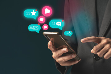 Person using a social media marketing concept on mobile phone with notification icons of like, message
