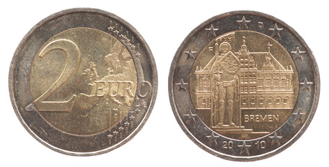 Germany - circa 2010 : a 2 Euro coin of Germany with a map of Europe and the historic town hall and the statue of Roland with sword and coat of arms in Bremen - obrazy, fototapety, plakaty