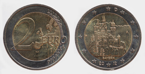Germany - circa 2012 : a 2 Euro coin of Germany with a map of Europe and  the Neuschwanstein Castle...
