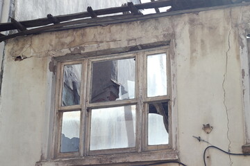 haunted house ruins with broken window glass.