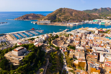 Aerial view of cityscape and marina of Spanish city of Cartagena in sunny summer day, Region of Murcia