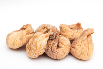 heap of Dried figs on a white background