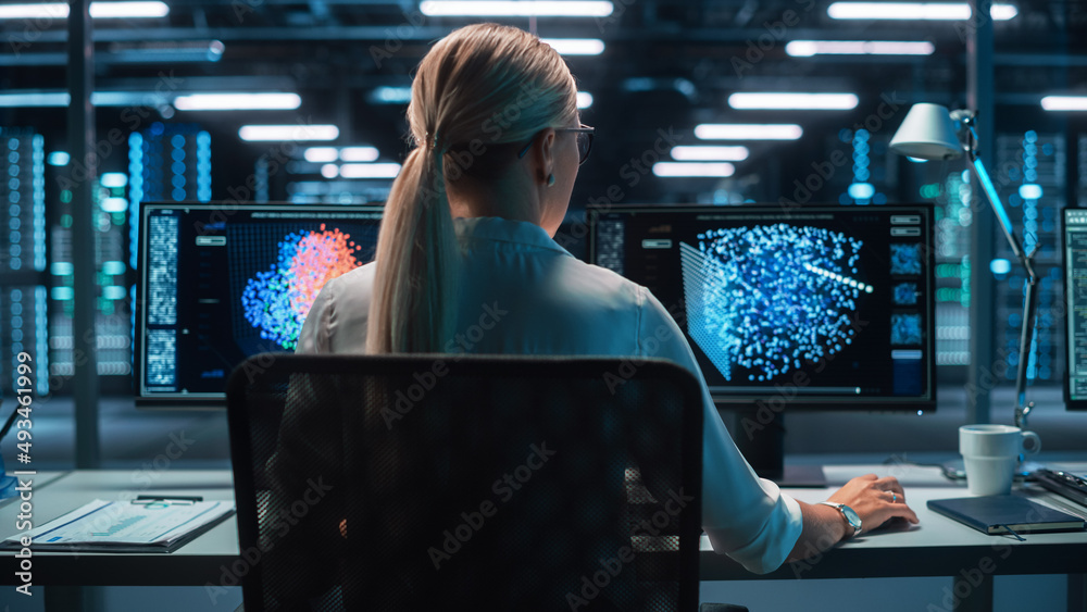 Poster Back View of the Woman Computer Administrator and Scientist Create Neural Network at the Evening Office. Two Displays Showing 3D Representations of Neural Networks