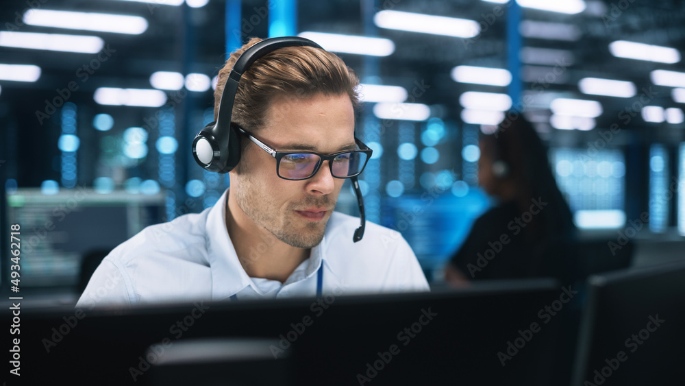 Aufkleber Machine Learning Engineer or System Administration Programming at His Workstation. Man Plans and Carries Out Work to Expand the Network Structure of the Enterprise at His Office