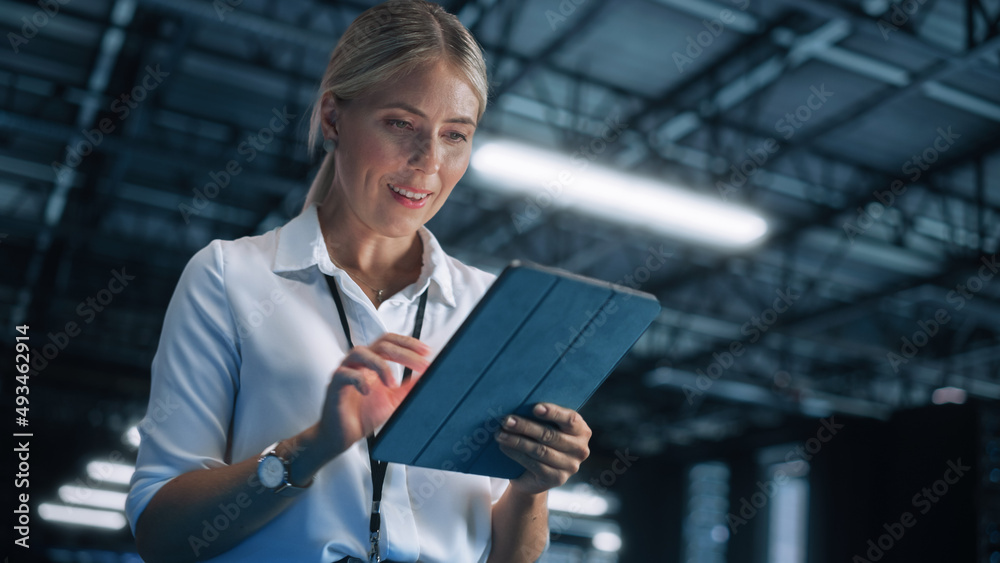 Poster Blonde IT Specialist Using Tablet Computer in Data Center, Walking on a Bridge Overlooking Big Server Farm Cloud Computing Facility. Businesswoman, e-Business Entrepreneur