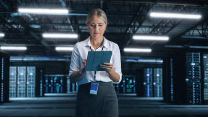 Evening Office: Portrait of Successful Female Chief Engineer or CEO Using Tablet Computer to...