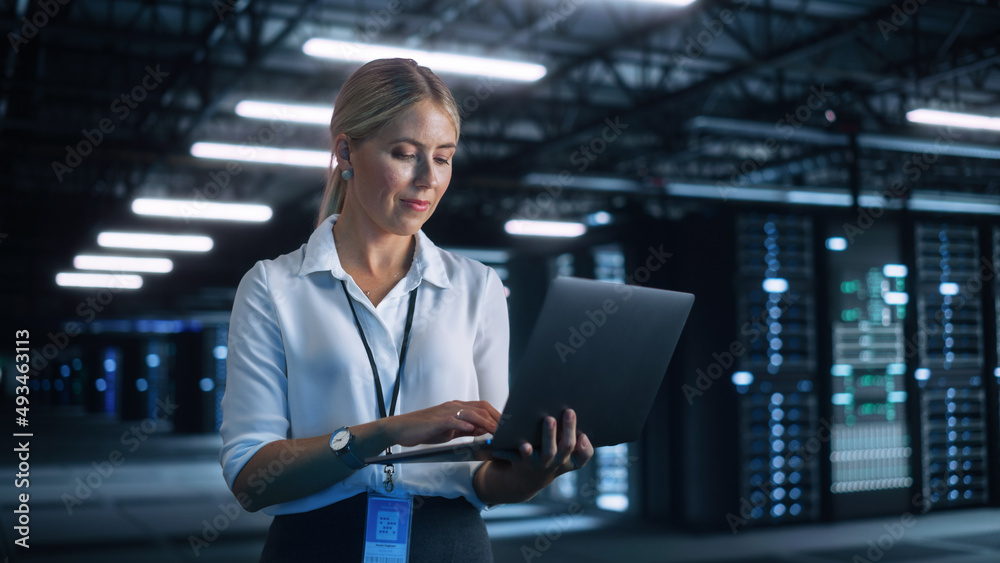 Poster Portrait of Successful Female Chief Engineer or CEO Using Laptop Computer to Optimise Server Farm Cloud Computing Facility at the Evening Office. Cyber Security, Network Protection Concept