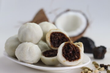 Steamed rice dumpling with a filling of palm jaggery and freshly grated coconut. Popular food of kerala commonly called Kozhikatta