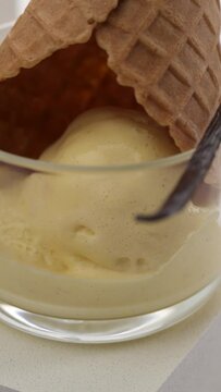 Vertical video: Ice cream in a waffle cup