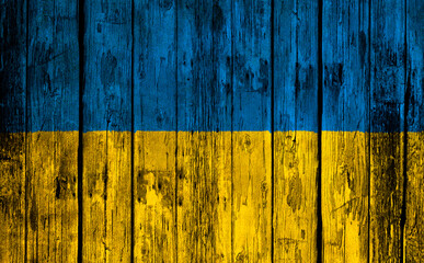 Flag of Ukraine on a wooden textured background