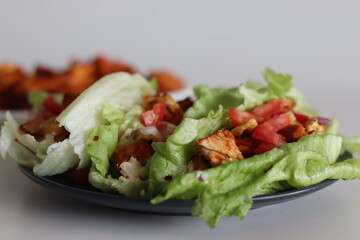 Lettuce chicken wrap. Tandoori chicken bites, sauteed baby corn, fresh cut tomatoes and onions tossed and wrapped in iceberg lettuce leaves.