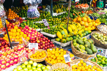 Several varieties of tropical fruits neatly arranged for sale in local market in Sri Lanka.