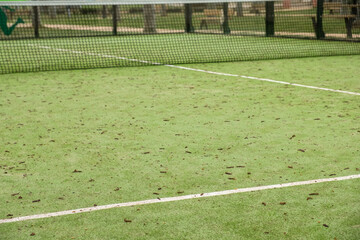 lines of a green paddle tennis court