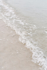 Sandy beach and water wave. Clear water. Beachside. Relax and calmness - 493468335