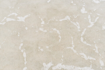 Sandy beach and clear sea water background