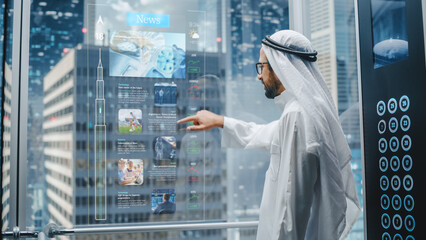 Successful Muslim Businessman in Traditional White Kandura Scrolling Through News Using Holographic...