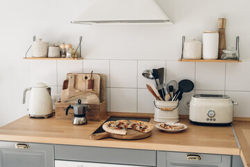 Modern closeup of pizza on the kitchen on white background for decoration design. Modern home decor. White background. Vintage style. Wooden background. Modern design. Closeup food. Top view.