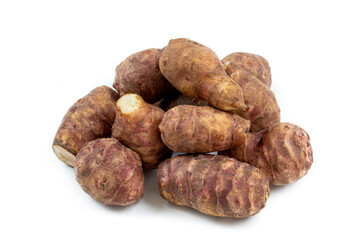 Jerusalem artichoke vegetables, isolated over white background with reflection. Helianthis tuberosus.