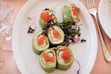 Snacks with red caviar at a holiday party. Food on the table in a restaurant