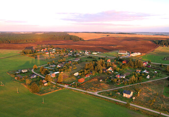 Country houses in countryside, aerial view. Building a Home in the Country. Village with wooden...