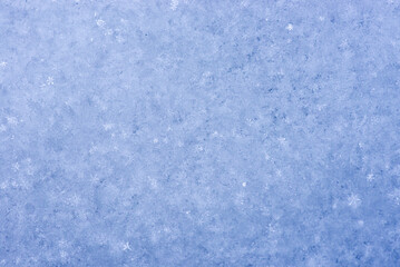 blue background. Snow texture close-up. Snow background