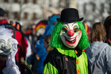 Basel - Switzerland - 9 March 2022 - portrait of masked people wearing traditional costumes of...