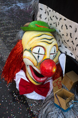 Basel - Switzerland - 9 March 2022 - Closeup of traditional mask of clown at the famous carnival in the street