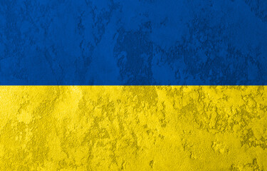 Concrete wall colored with Ukrainian flag colors