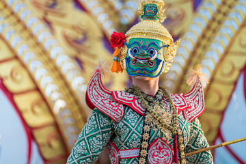 Masked giant dancing khon ramayana khon Ravana. Giant carrying a sword. Ramayana story.