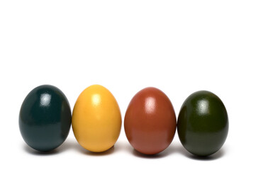 Closeup colored Easter eggs standing white background