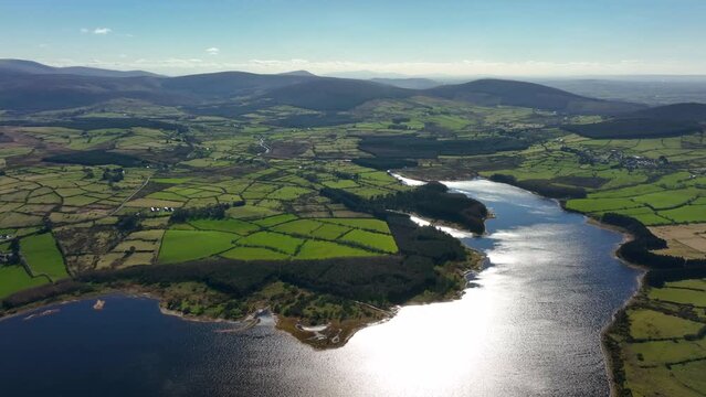 Blessington Lakes, Wicklow, Ireland, March 2022. Drone pushes south towards Monamuck above the Liffey Reservoir with Blackditches Upper and Lockstown Upper in the distance.