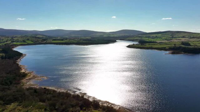 Blessington Lakes, Wicklow, Ireland, March 2022. Drone ascends above the Liffey Reservoir while facing south towards Monamuck and Slievecorragh.