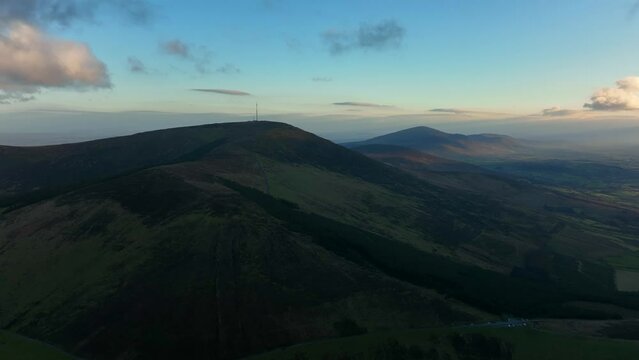 Mount Leinster, Carlow, Ireland, March 2022. Drone slowly orbits the summit from the northwest with the Killedmon, the Blackstairs and Kilkenny in the distance.