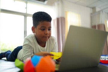 portrait of mixed race kid using mobile phone.