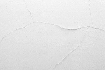 Naklejka premium The white concrete wall is cracked, the paper is cracked