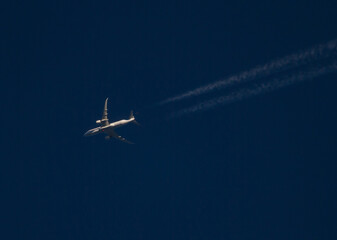 Commercial Jet with Contrails at Sunset