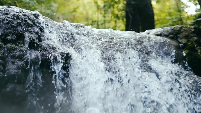 River waterfall seen from water surface, split view over and under water. slow motion. 4K
Deep forest Waterfall. 1