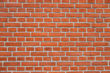 Orage-rote Backsteinwand als Hintergrund oder Textur